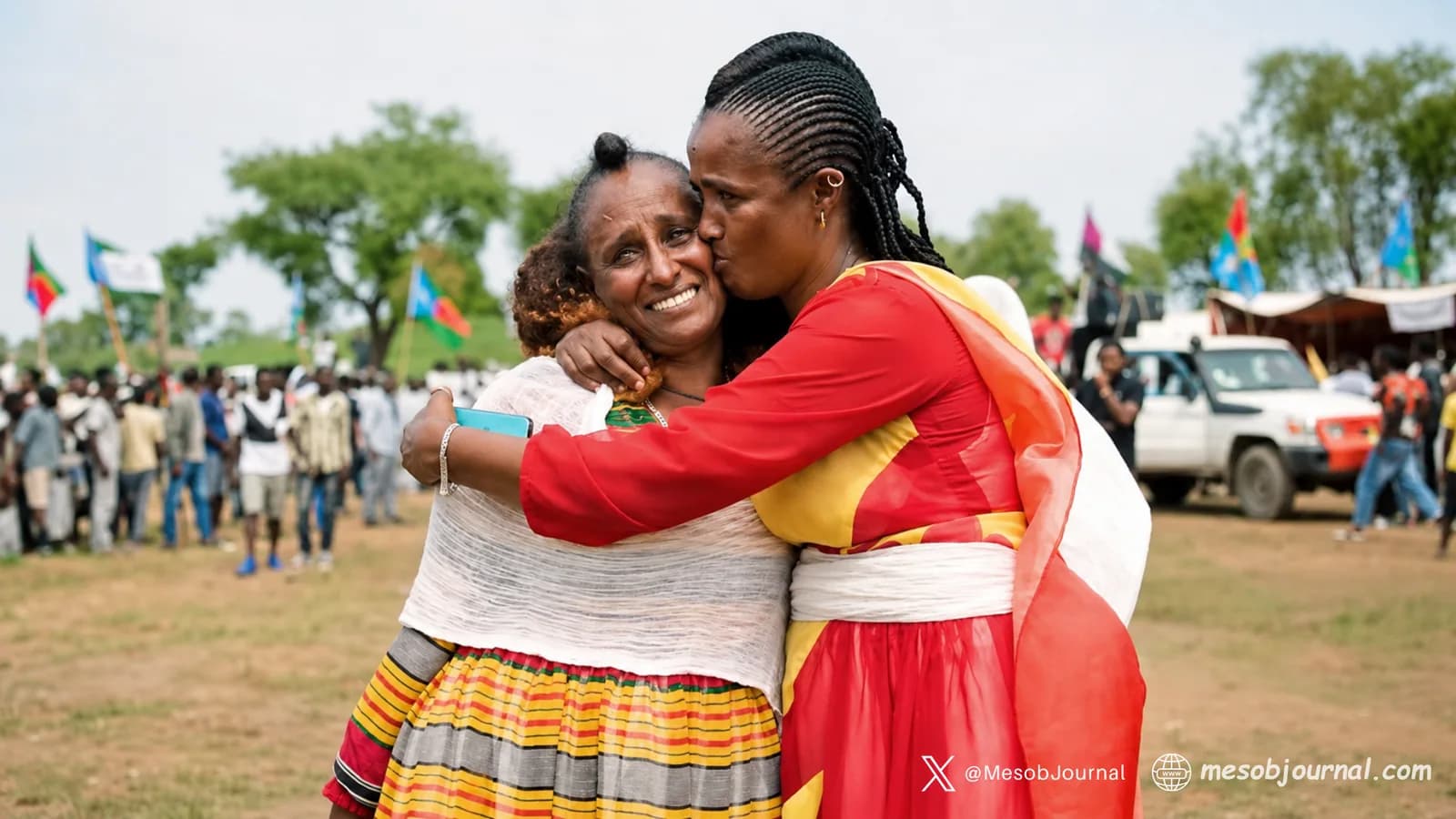An Eritrean mother and a Tigrayan mother embrace for peace at a community gathering.