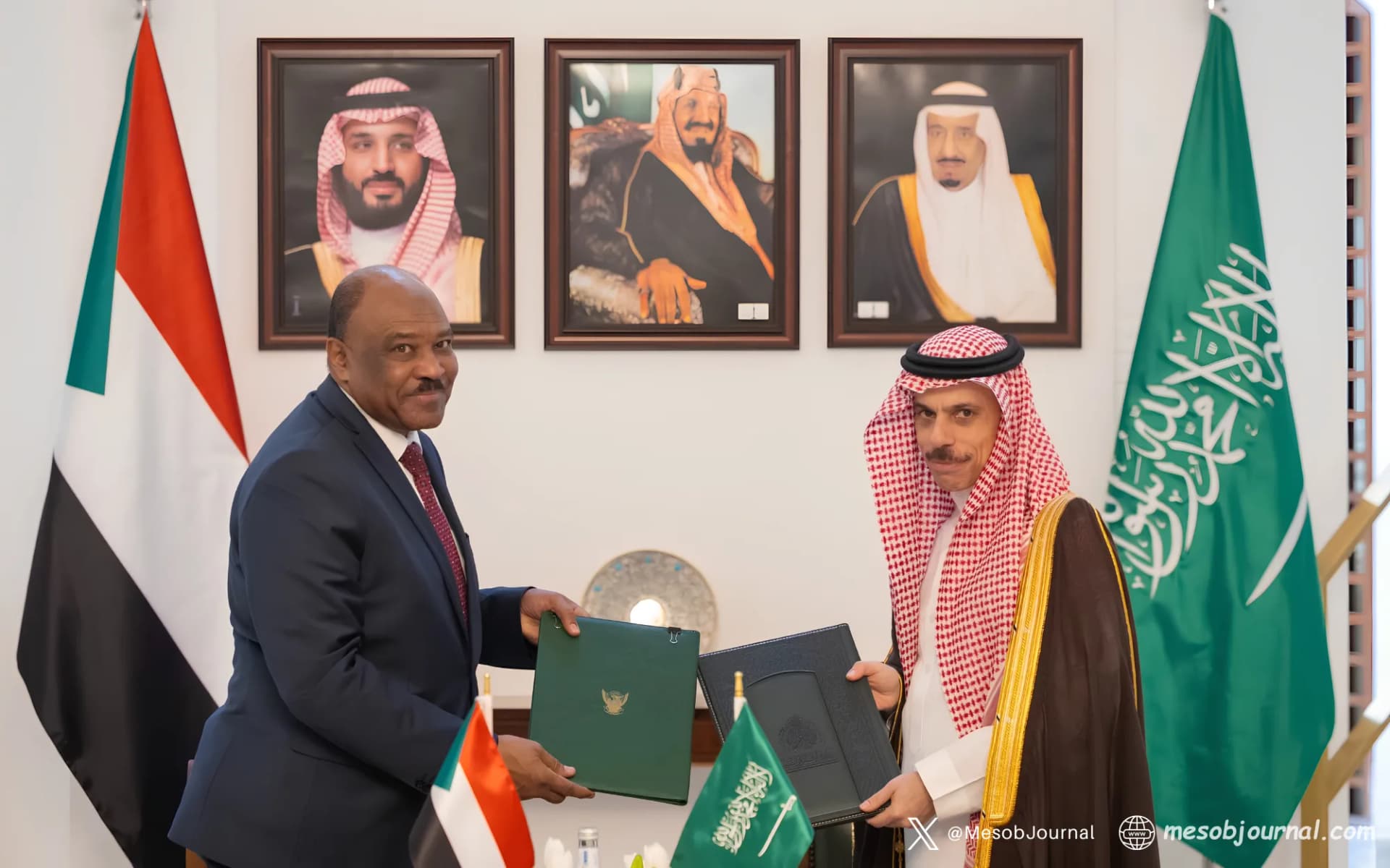 Sudanese Foreign Minister Mohieldin Salem and Saudi Foreign Minister Prince Faisal bin Farhan